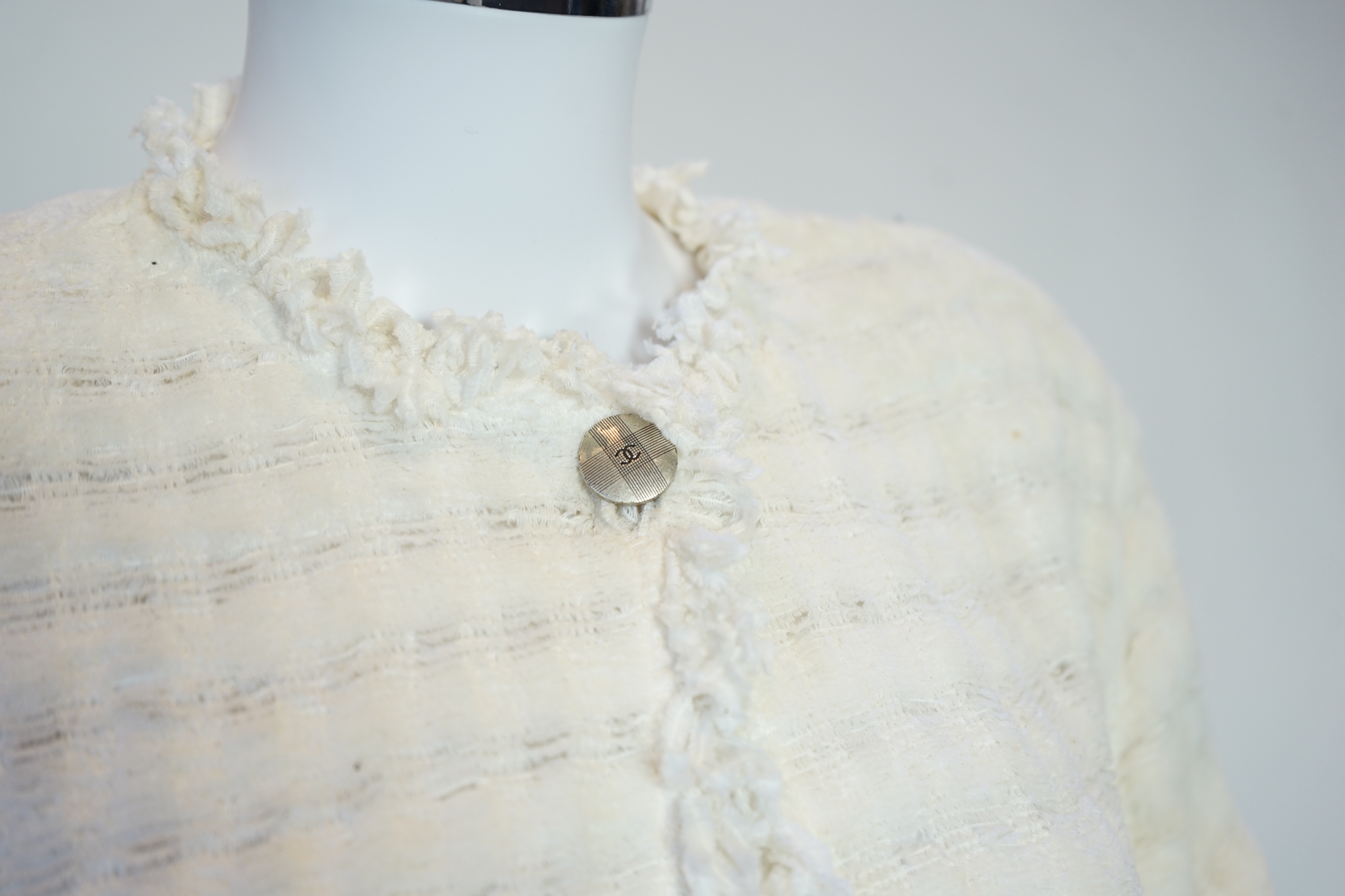 A Chanel early 1990's cream boutique jacket, size 40